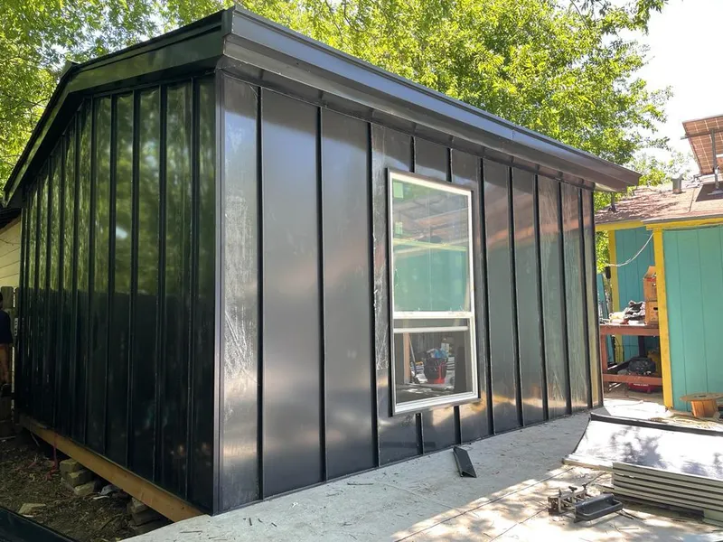 Black standing seam metal wall panels for Metal Roof Installation in Stratham